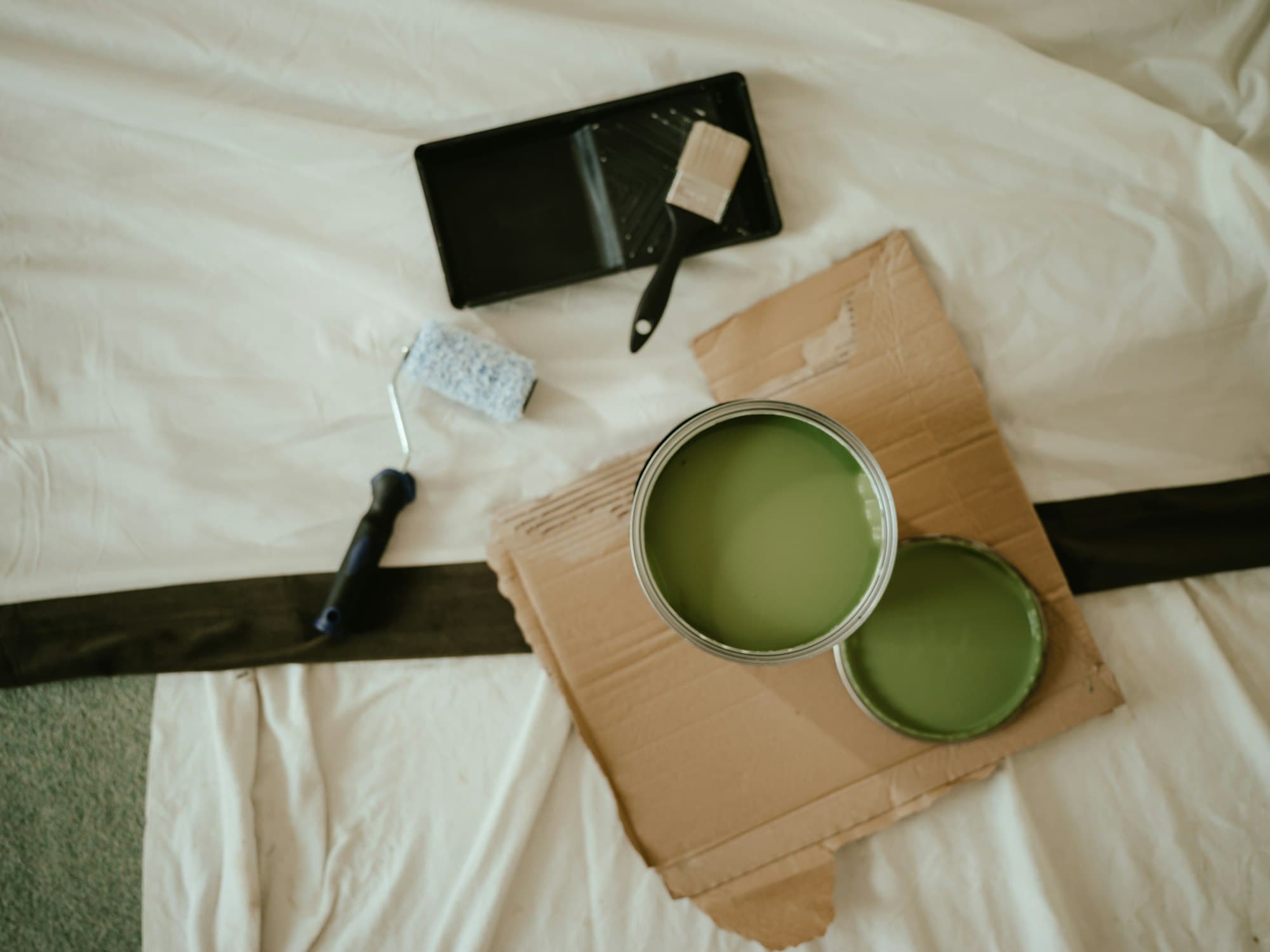 Cozy, freshly painted interior with morning coffee on the bed — the feeling of a home that fits you