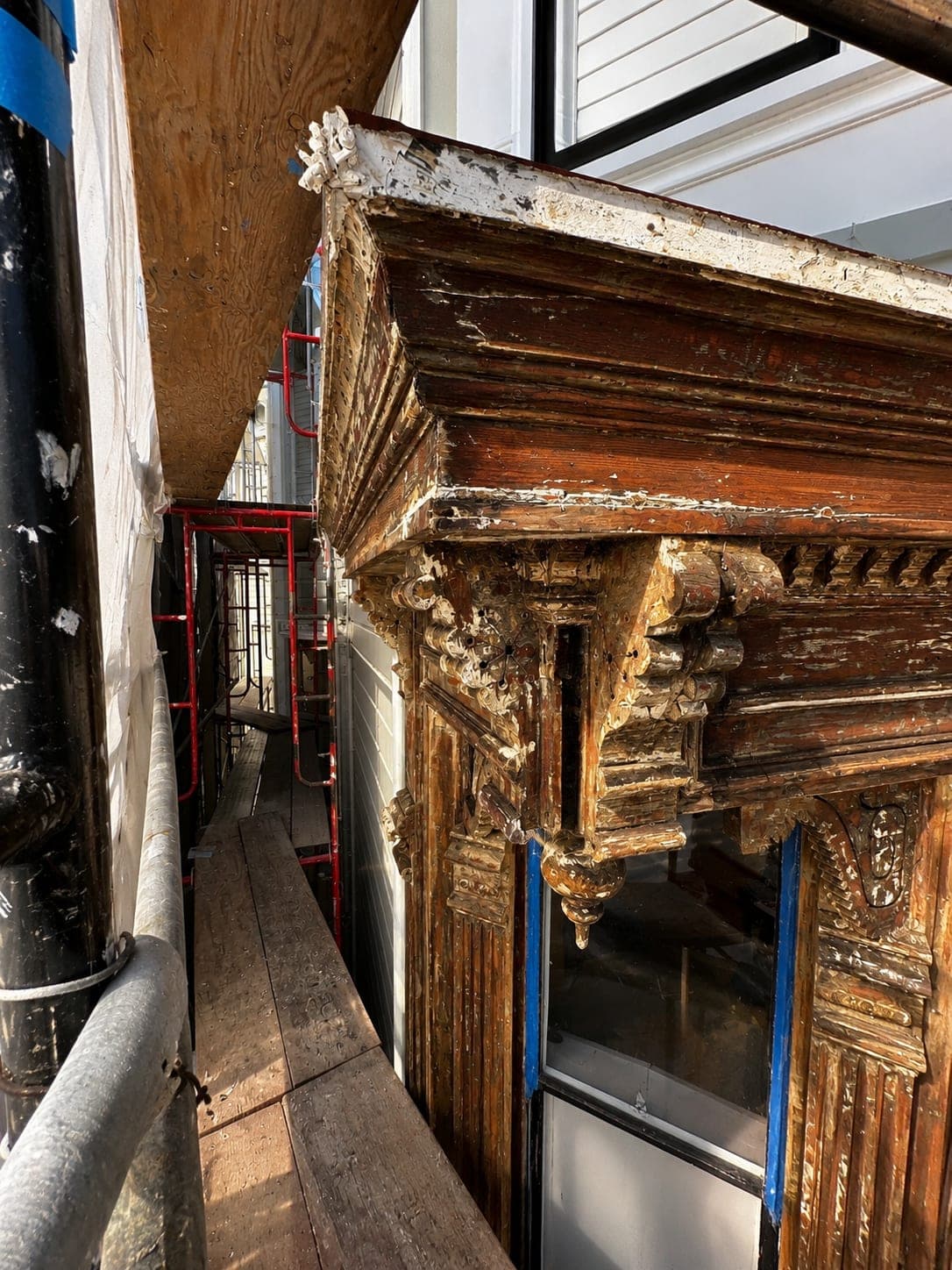 Close-up of severely weathered original Victorian cornice and bracket before restoration